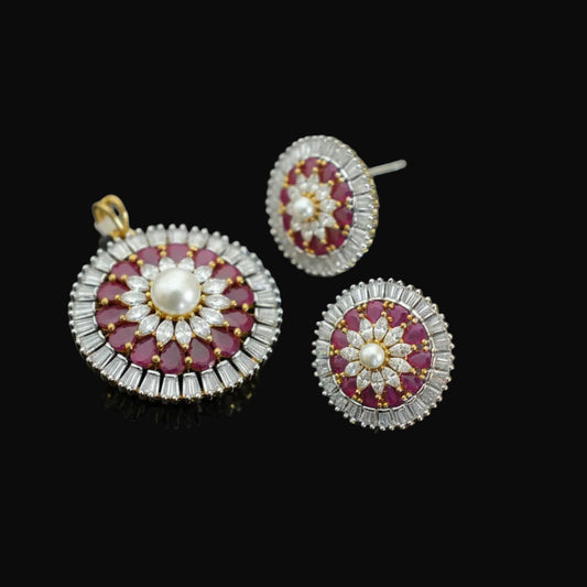 Ornate earrings with red and white stones on a dark background, featuring the brand 'Saheili'.