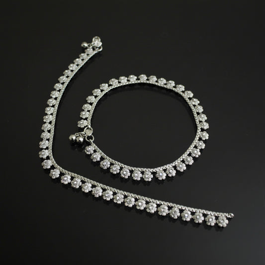Silver necklace with a clasp on a dark background