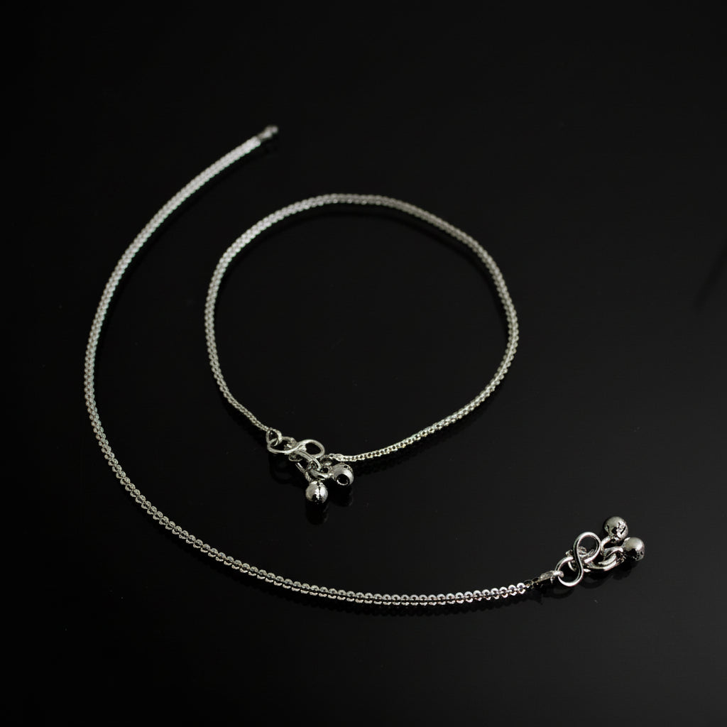 Silver necklace with pendant on a dark background