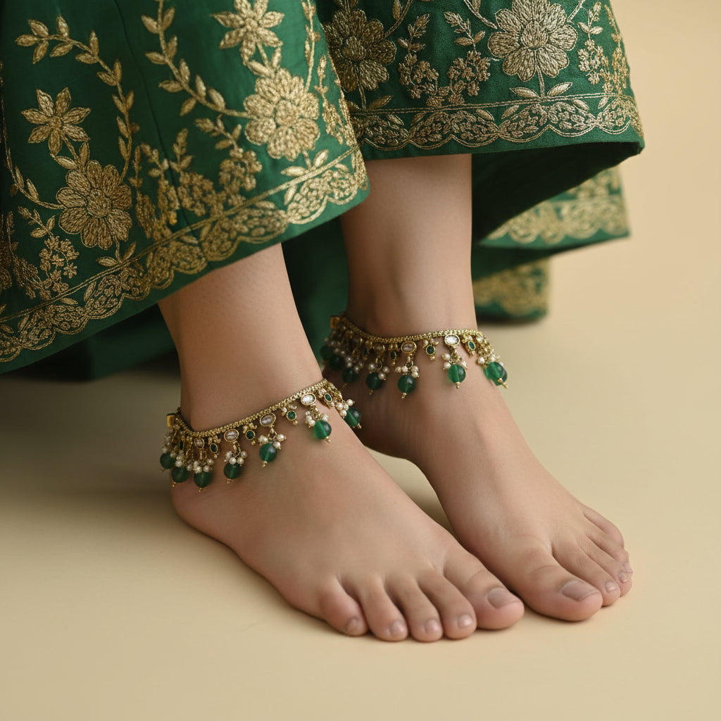 Ornate necklace with green stones on a dark background, featuring the brand 'Saheli'.