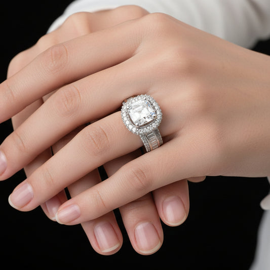 Silver ring with a large diamond on a black mannequin hand, branded 'Saheli'.