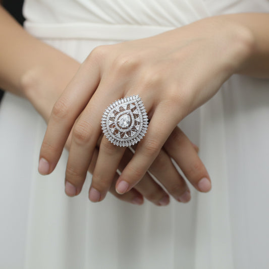 Diamond ring on a black mannequin hand against a dark background