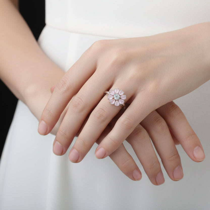 Diamond ring on a black mannequin hand against a dark background