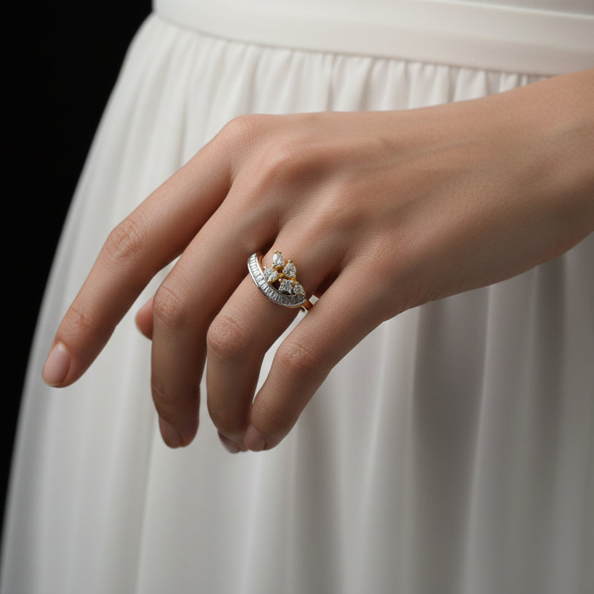 Gold and diamond ring on a black gloved hand with 'SAHELI' branding.
