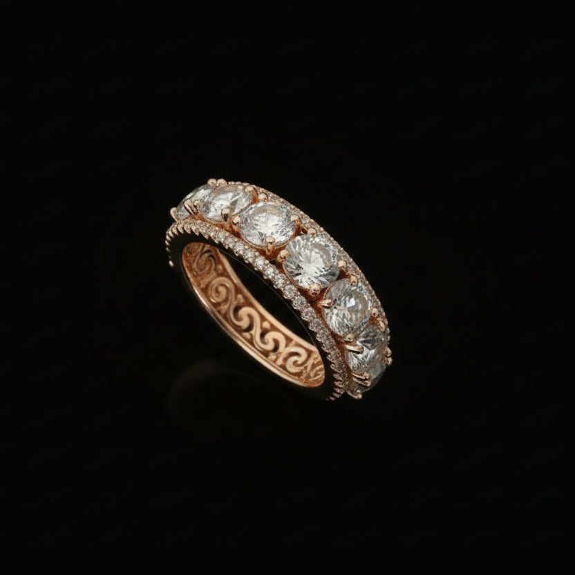 Elegant ring with multiple gemstones on a dark background