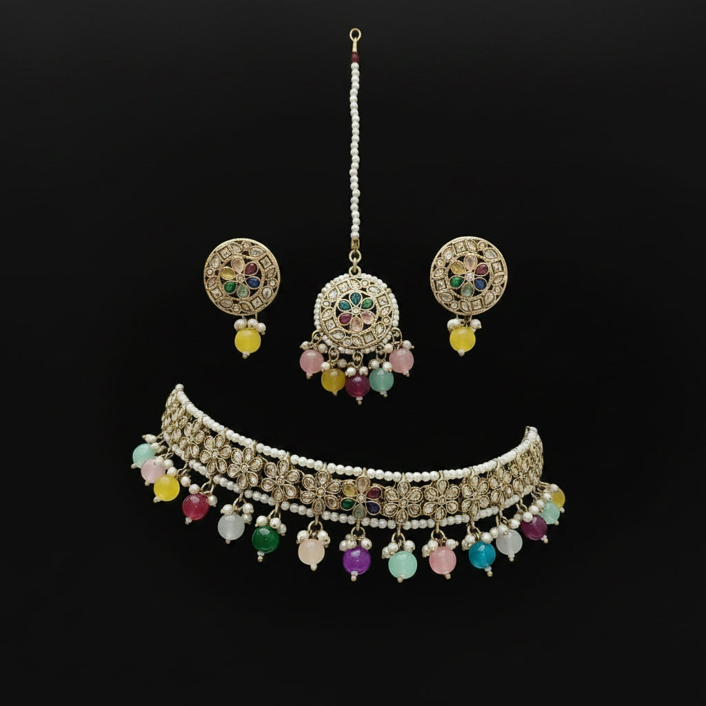 Mehendi Polish Choker Set with colorful beads on a gray stand against a black background