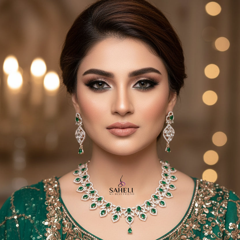 Jewelry set with necklace and earrings on a dark background, featuring the brand 'Saheli'.