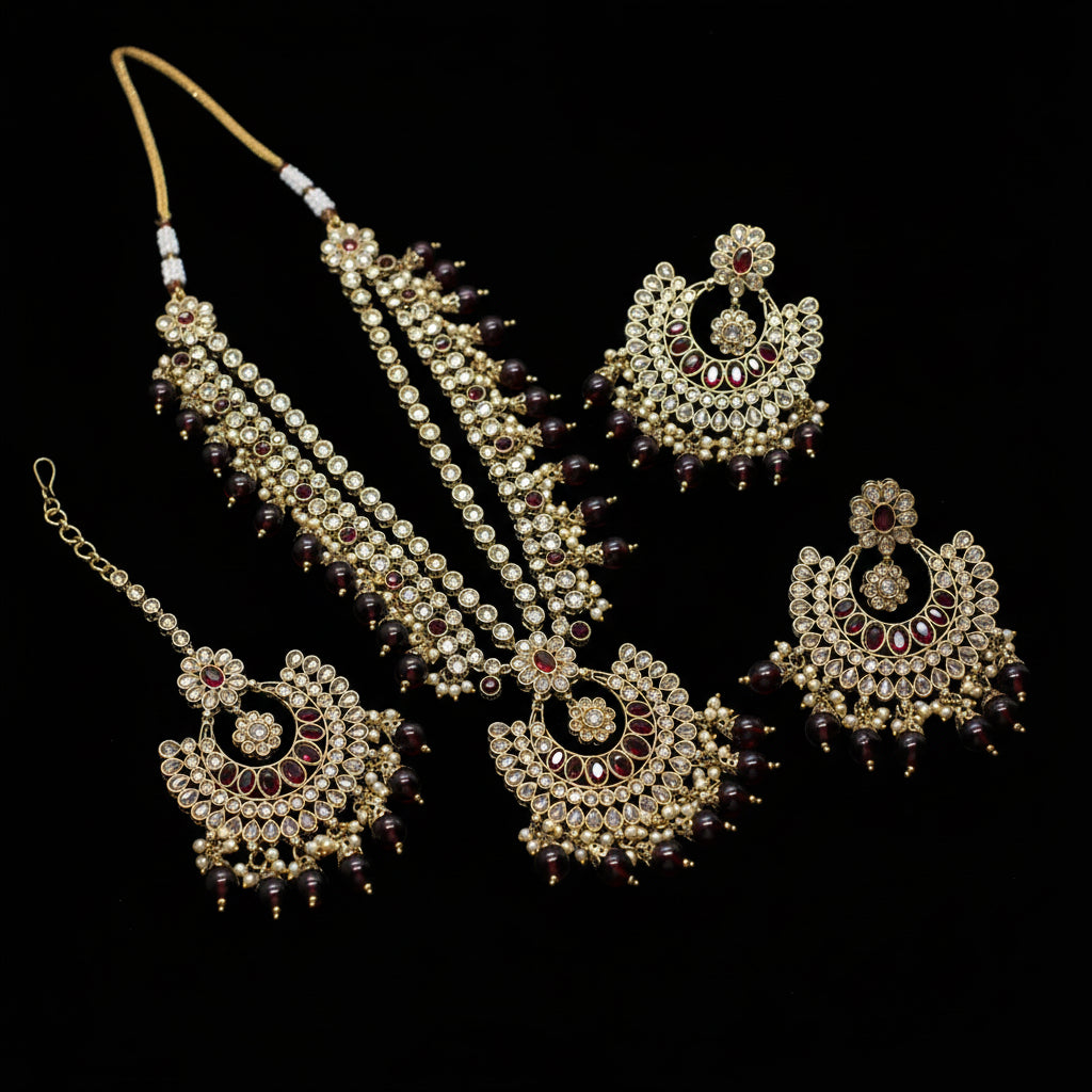 Jewelry set with necklaces and earrings on a dark background