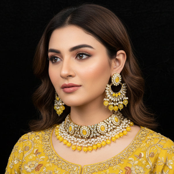 Jewelry set with yellow and white stones on a black background, featuring the brand 'Saheli'.