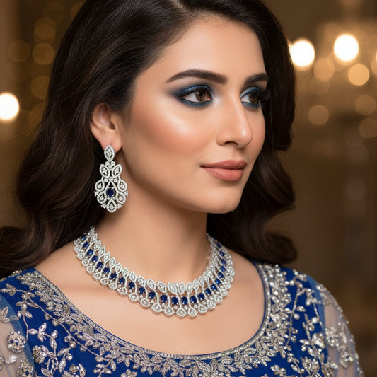 Jewelry set with necklace and earrings on a dark background, featuring the brand 'Saheli'.