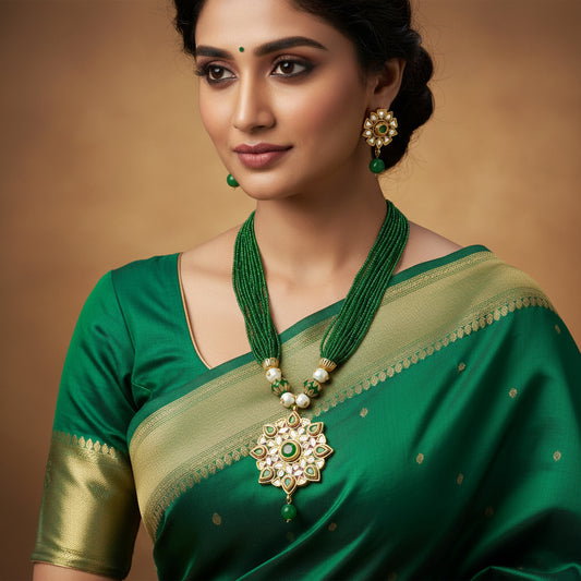 Jewelry set with green necklace and earrings on a dark background, featuring the brand 'Saheli'.