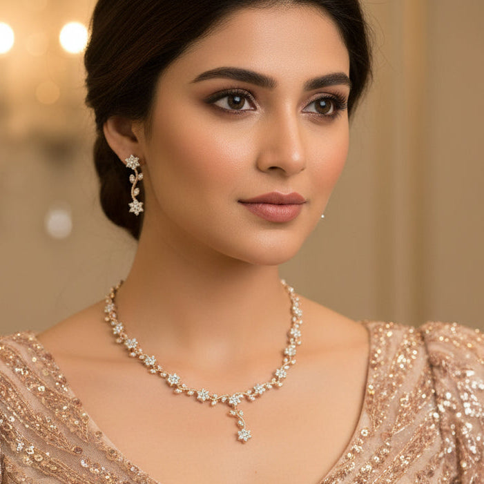 Gold and diamond necklace and earrings on a black background