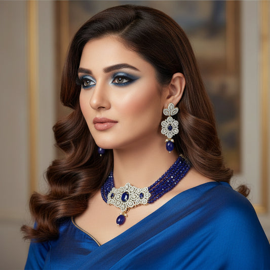 Jewelry set with necklace, earrings, and blue beads on a dark background