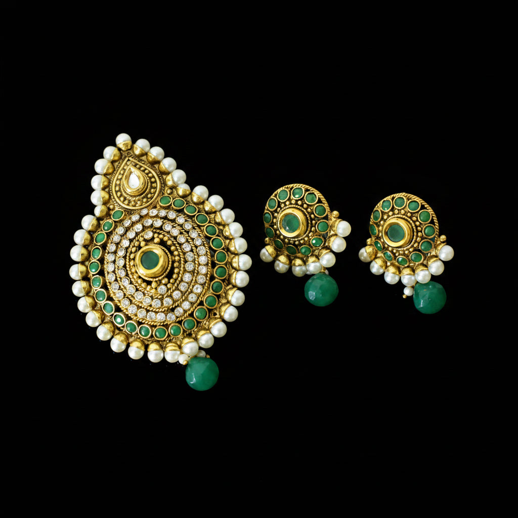 Ornate gold and green earrings with pearl accents on a gray background, branded 'Saheli'.