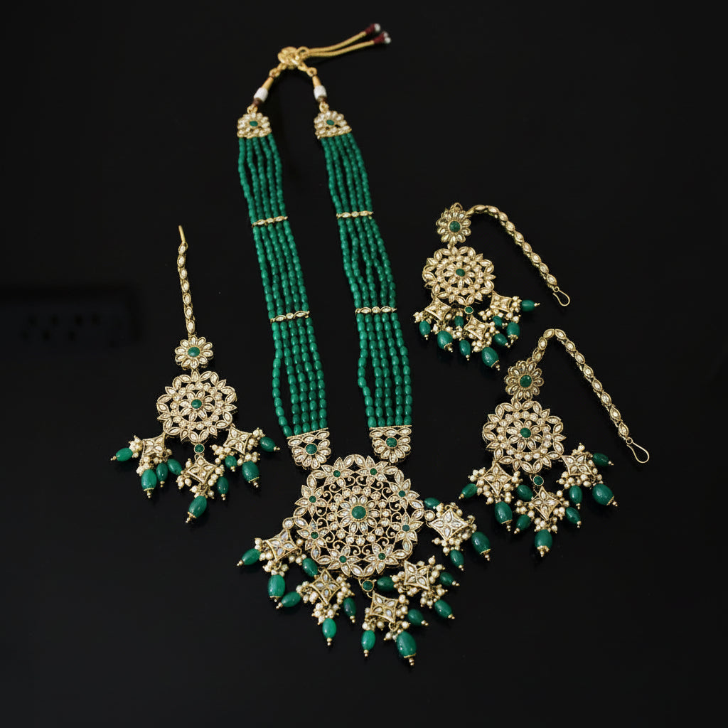 Jewelry set with necklace, earrings, and hair accessories on a black background