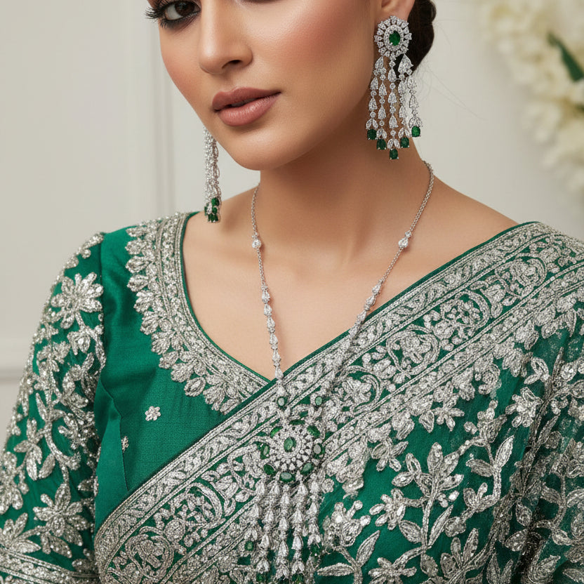 Jewelry set with necklace and earrings on a dark surface